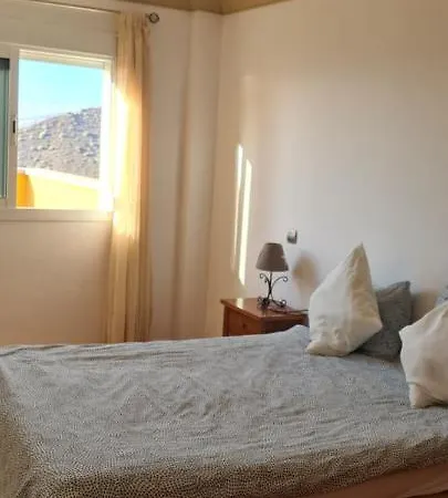 Apartment With A Serene Ocean And Mountain View