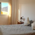 Apartment With A Serene Ocean And Mountain View