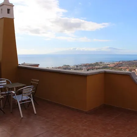 With A Serene Ocean And Mountain View *