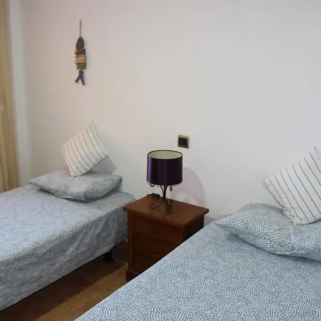 With A Serene Ocean And Mountain View