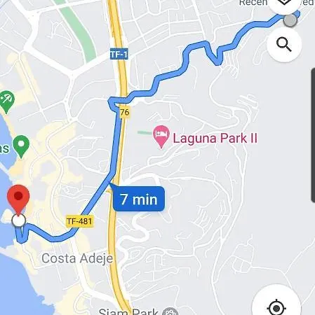 With A Serene Ocean And Mountain View Адехе