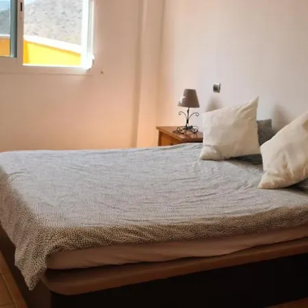 With A Serene Ocean And Mountain View Апартаменты