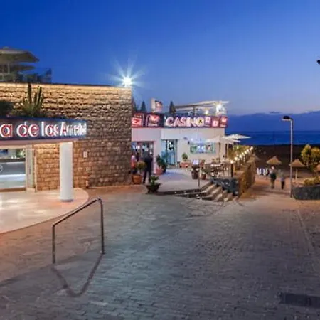 With A Serene Ocean And Mountain View