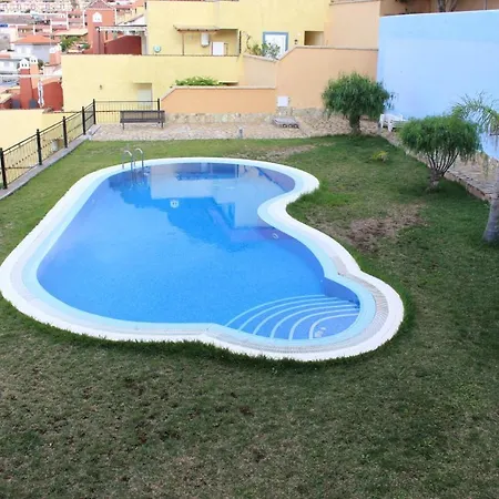 With A Serene Ocean And Mountain View